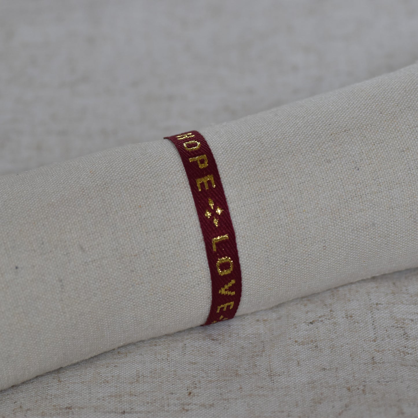 Lintarmband Faith, Hope, Love